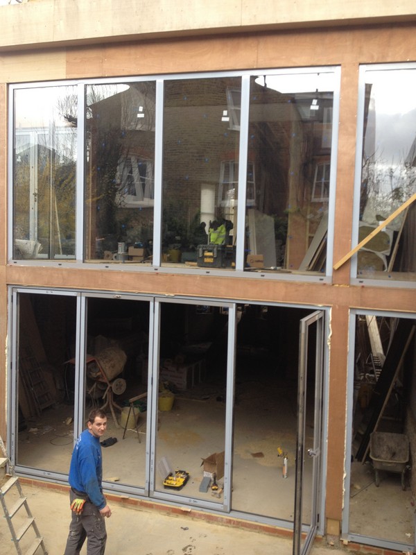 Aluminium bi-fold doors with two-storey glazing in Aldgate