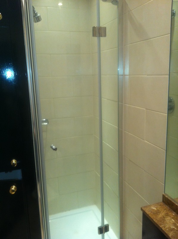 Frameless glass shower enclosure with chrome fittings in Aldgate