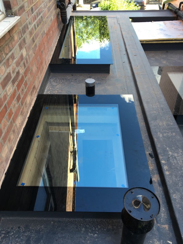 Multiple flat roof skylights on extension in Aldgate