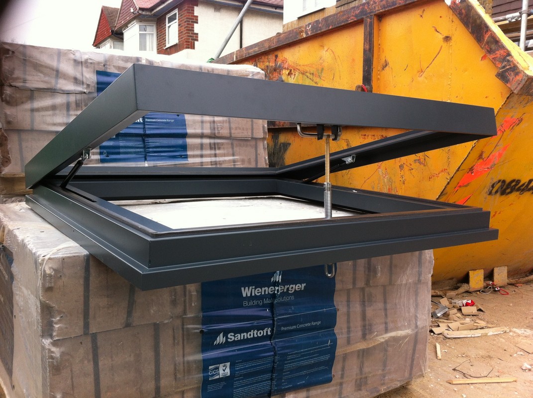Opening flat roof skylight in anthracite grey installed in Aldgate